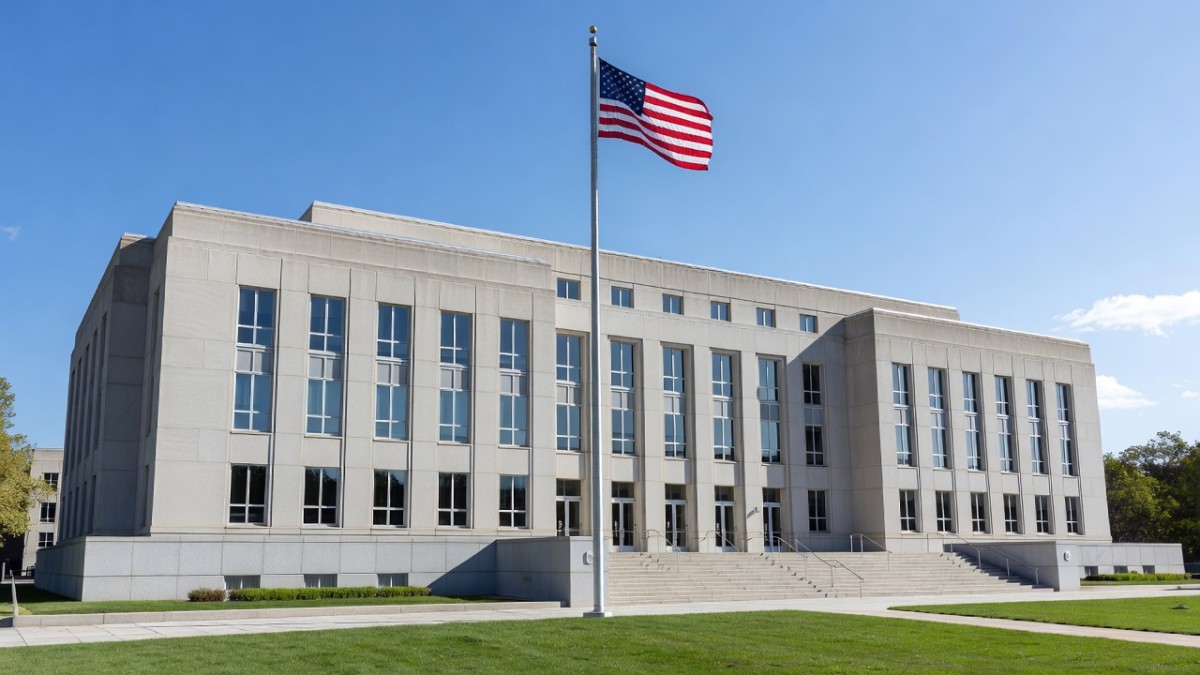 Exterior of a federal office building with an American flag
