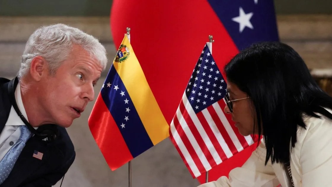 US Energy Secretary Chris Wright and Venezuela acting president Delcy Rodriguez attend an oil agreement signing ceremony at Miraflores Palace in Caracas
