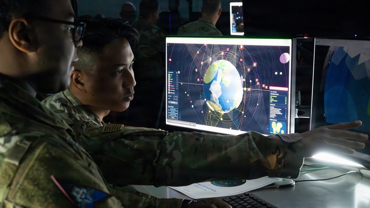 U.S. Space Force personnel monitor a space tracking display inside a control room. Photo: Ars Technica