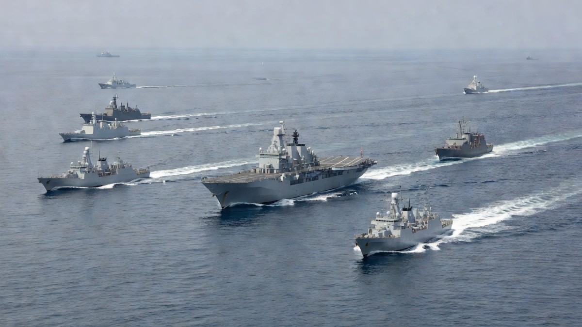 Chinese amphibious assault ship and naval vessels sailing in the Western Pacific during exercises