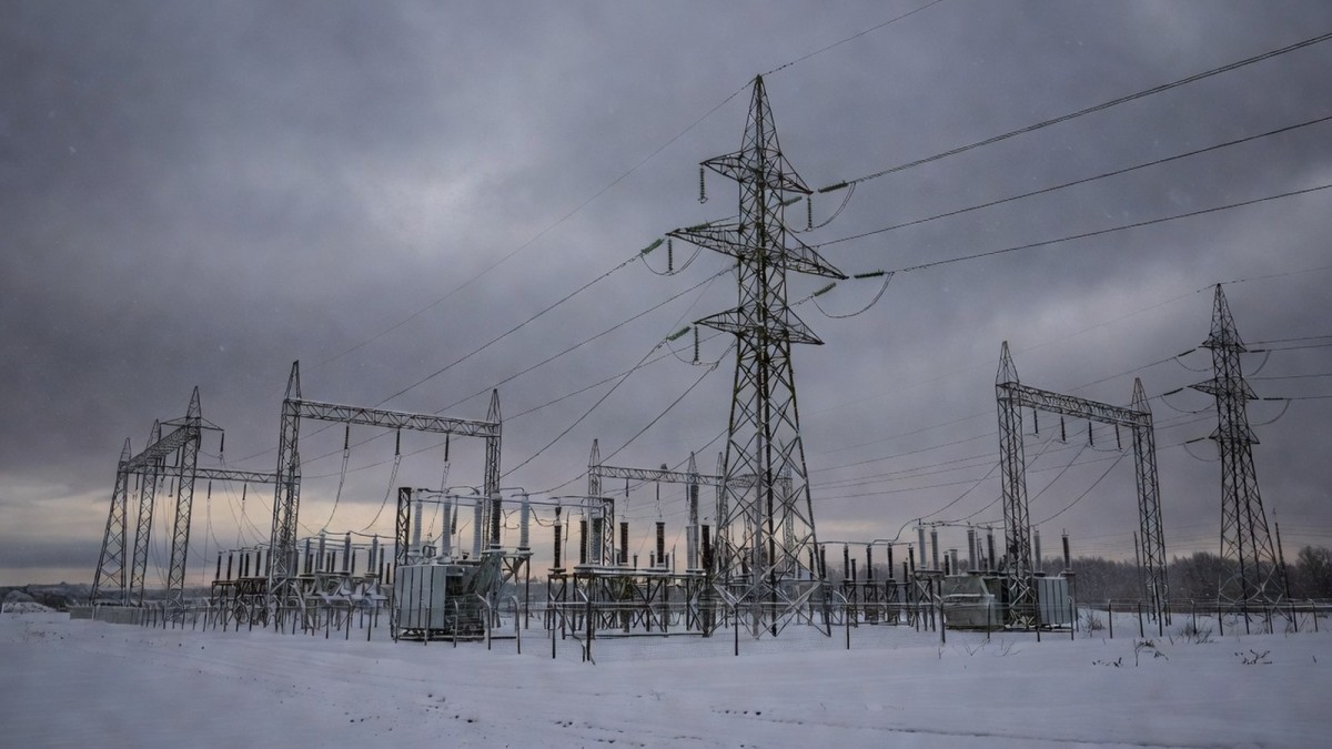 Electrical transmission towers and a power substation in Ukraine under a winter sky — the energy grid Kyiv fears Russia will target again