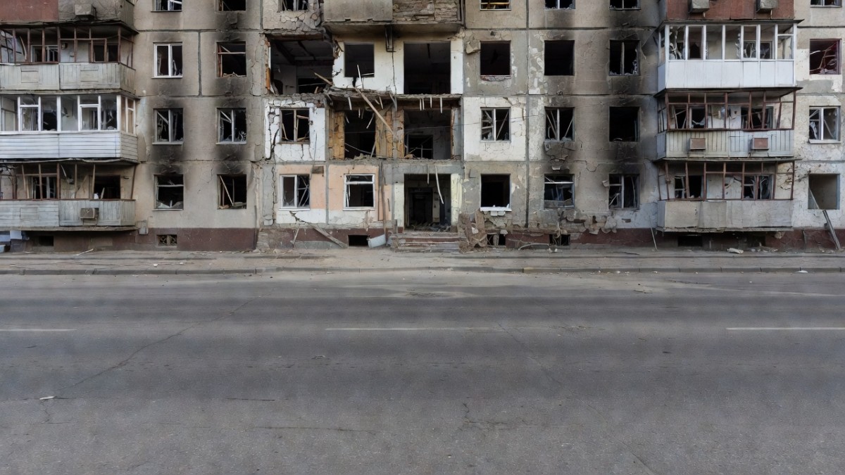 Residential buildings in an eastern Ukrainian town under daily bombardment near the front line