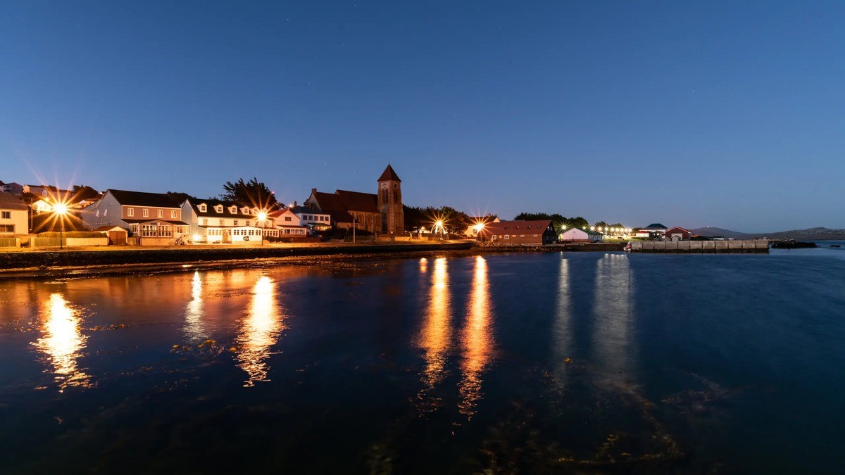Stanley, the capital of the Falkland Islands, seen across Stanley Harbour. Photo: Guy Wenborne / Falkland Islands Government
