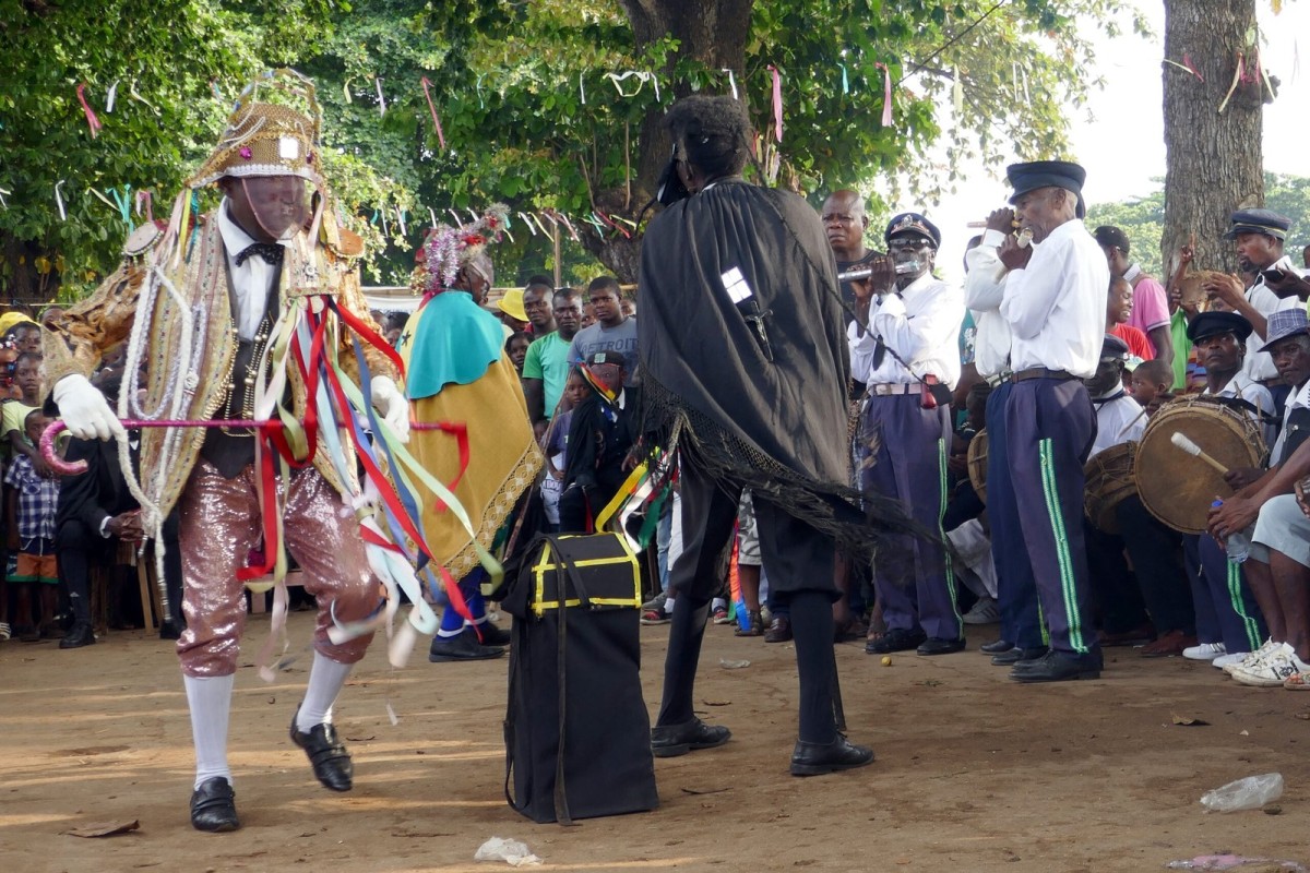 Open-air Tchiloli performance in Boa Morte, Sao Tome, with musicians and an engaged audience