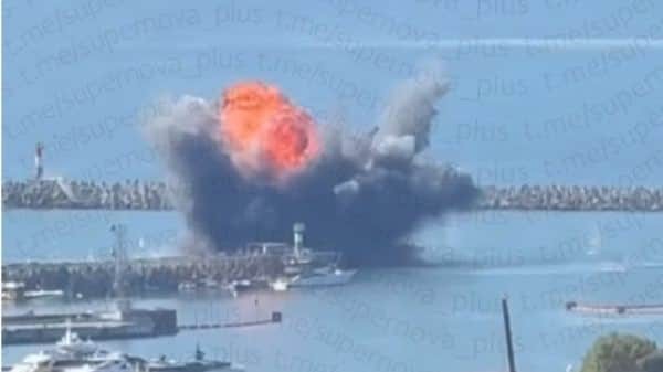 A column of black smoke rises over the port district of Sochi, Russia after the 3 September naval drone attack