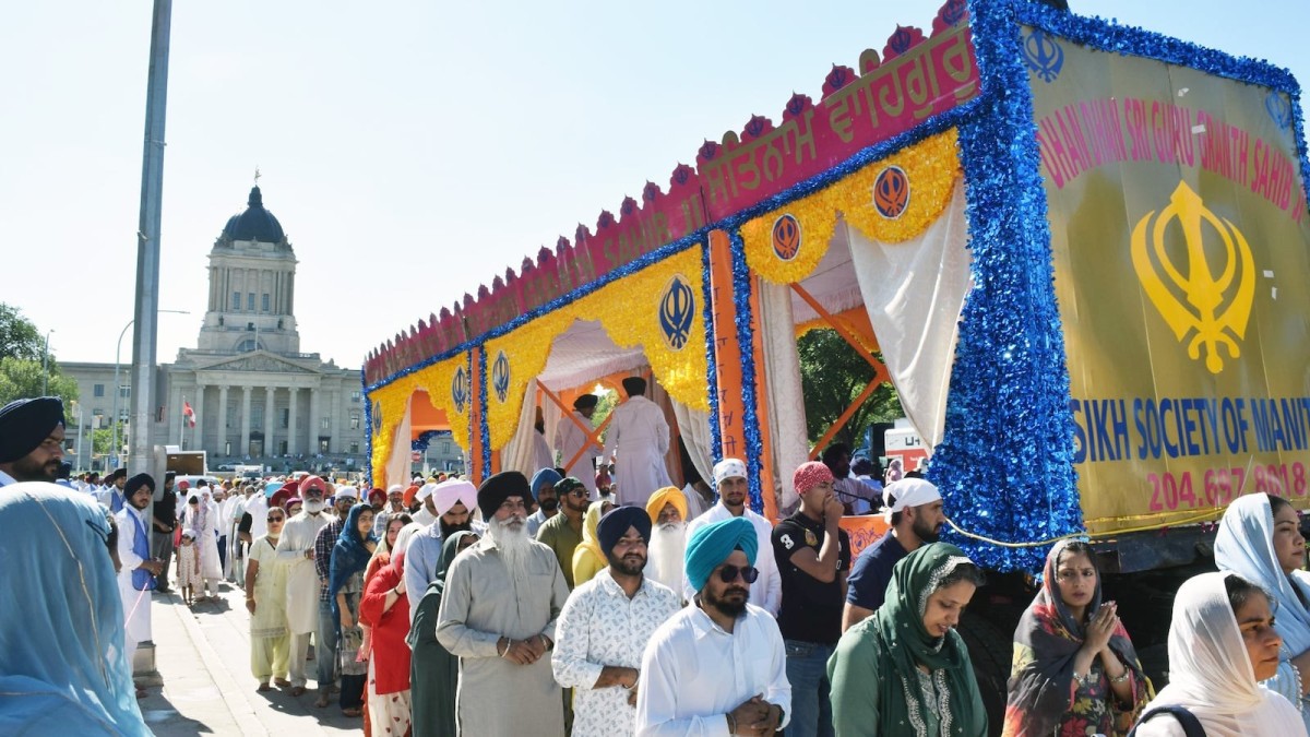 Nagar Kirtan procession in downtown Winnipeg carrying the Guru Granth Sahib past the Manitoba Legislative Building