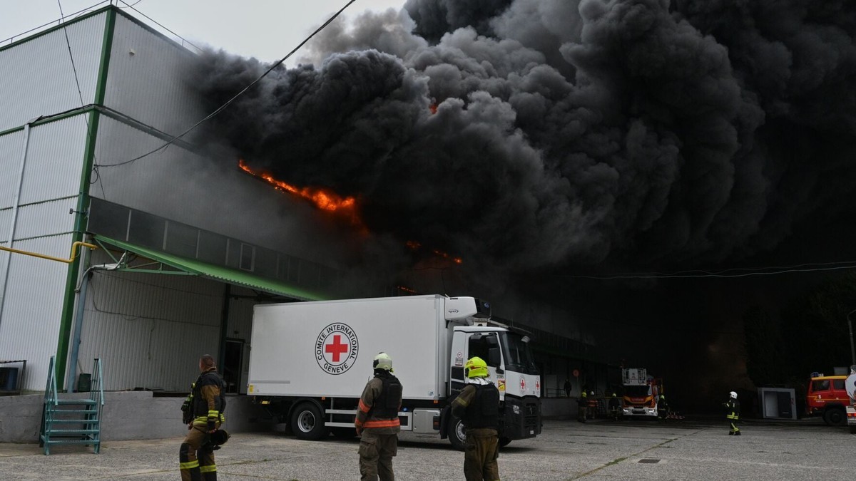 Firefighters work at a burning warehouse in Odesa, Ukraine, after a Russian air attack on 13 September 2026. Photo: Michael Shtekel/AP