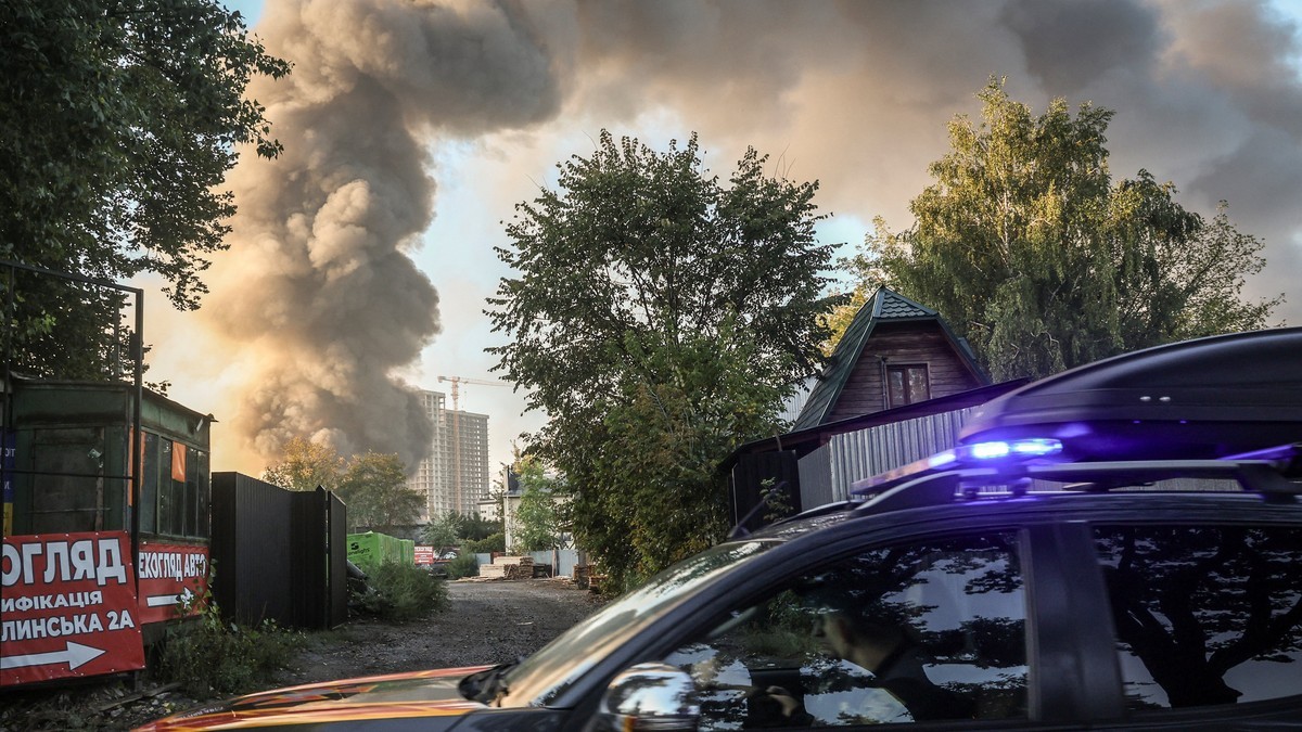 Smoke rises over a residential district as an emergency vehicle responds in Ukraine, in the same week the energy truce collapsed. Photo: Cyprus Mail