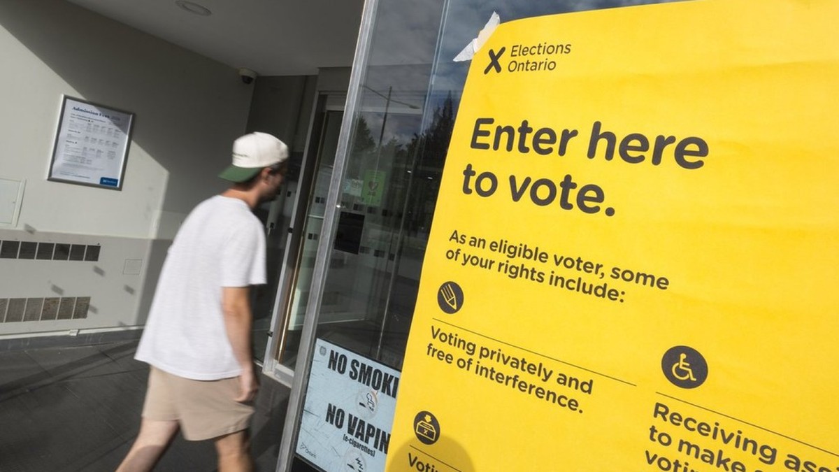 A voter enters an advance voting location during Ontario's byelections