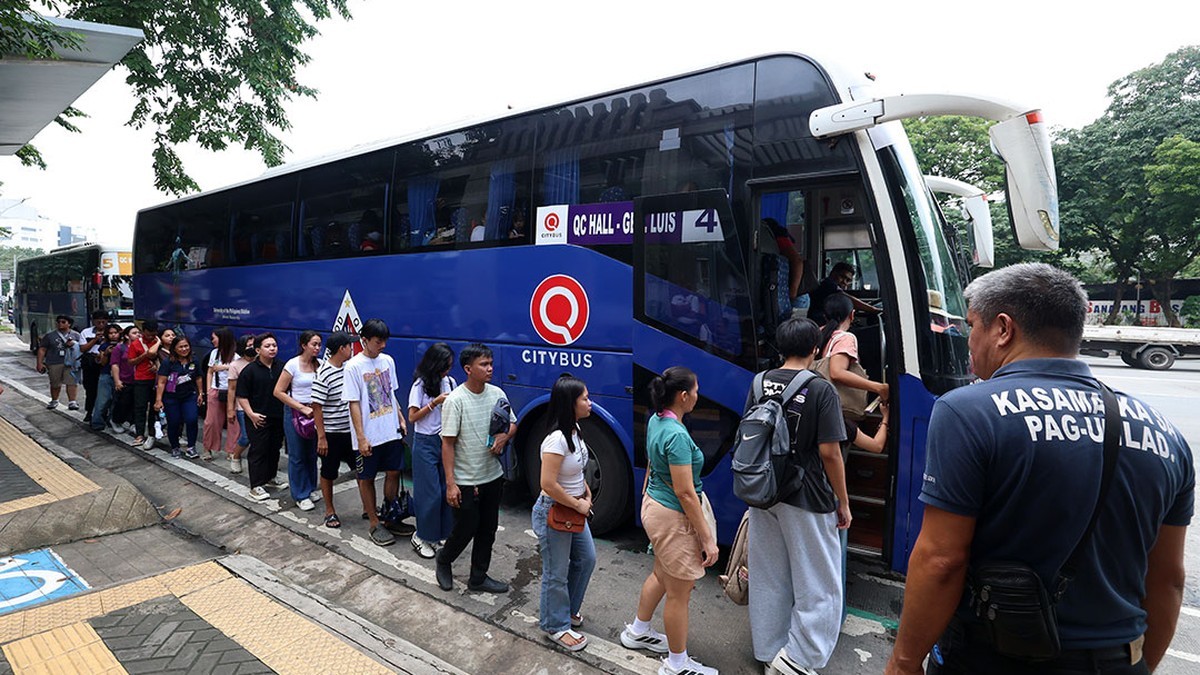 Passengers queue to board a bus at a terminal in Quezon City during the Philippines-wide transport strike. Photo: BusinessWorld Online
