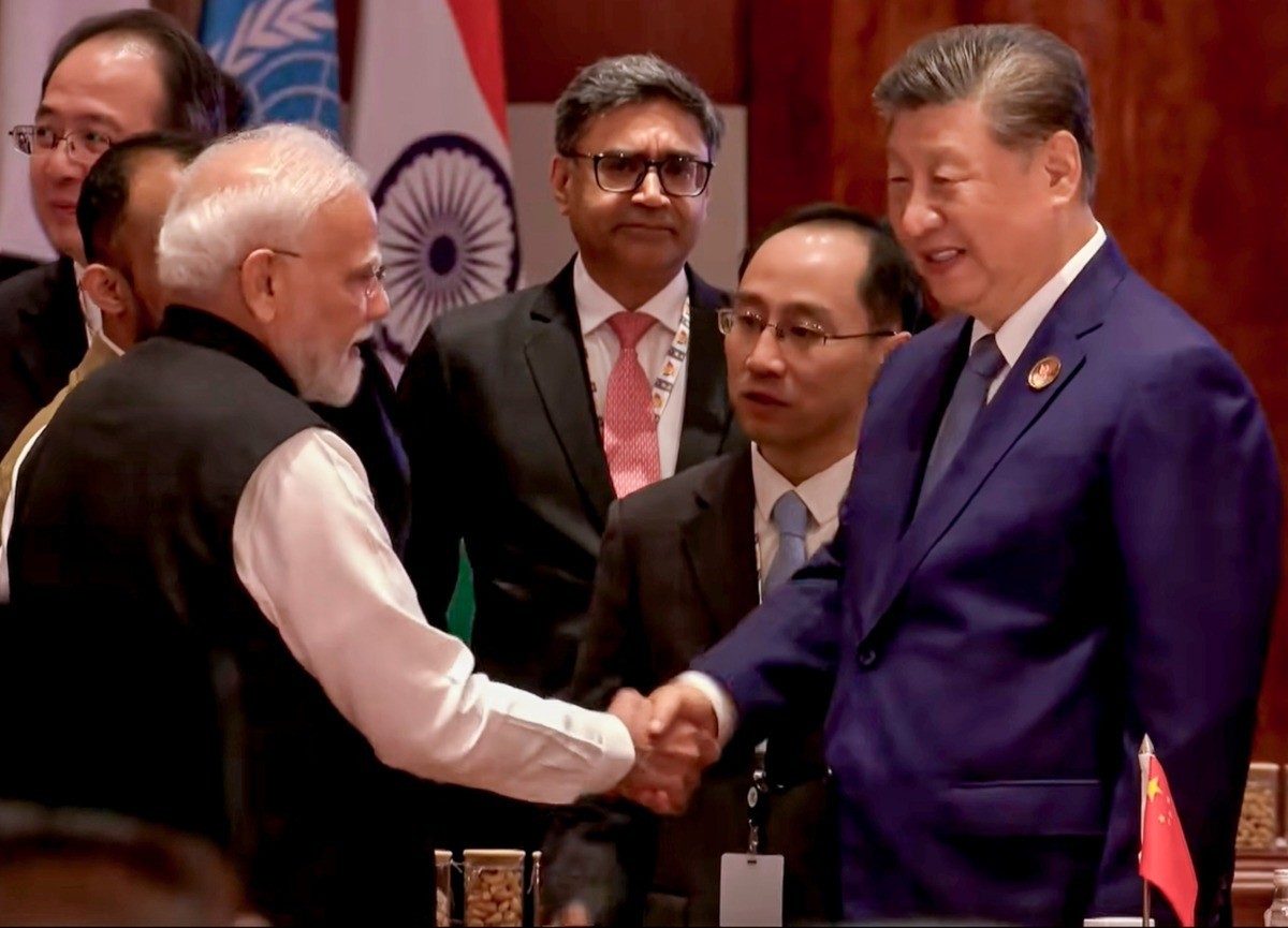 Prime Minister Narendra Modi and Chinese President Xi Jinping shake hands at the 18th BRICS Summit in New Delhi