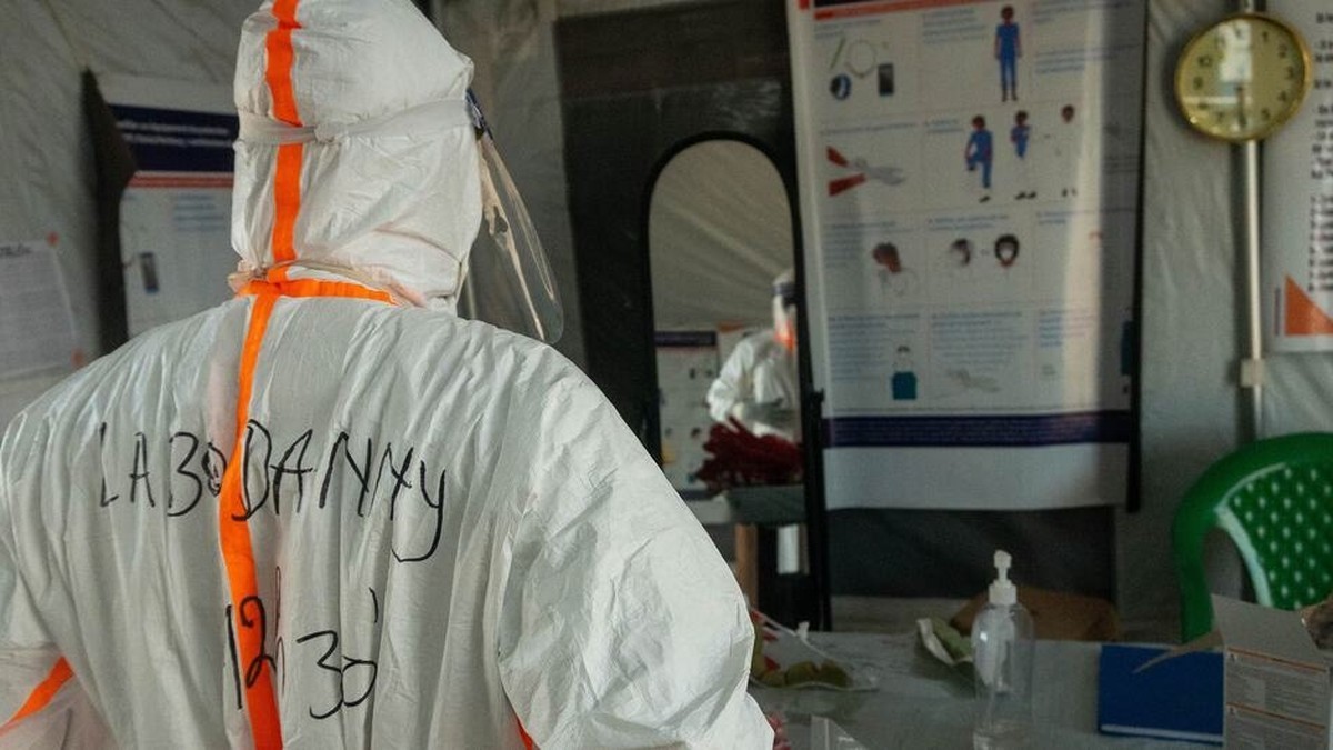 A health worker prepares for a shift at an Ebola treatment centre in Rwampara, Ituri province, eastern Democratic Republic of Congo. Photo: UNOCHA/Priscilla Lecomte