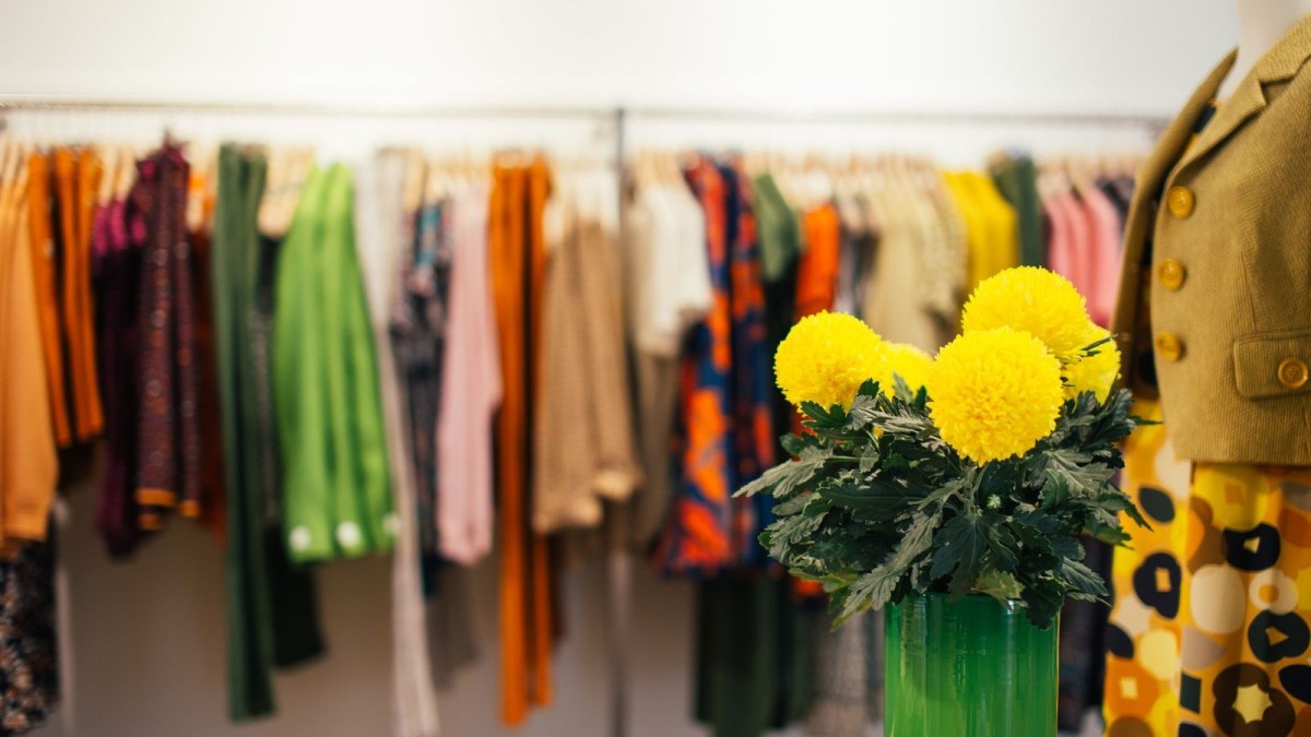 Colorful clothes hanging on a rack in a fashion store