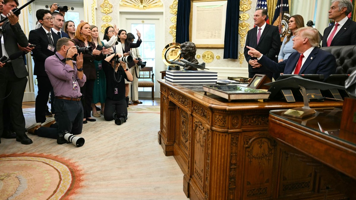 President Donald Trump takes questions from reporters in the Oval Office at the White House. Photo: AFP via Getty Images