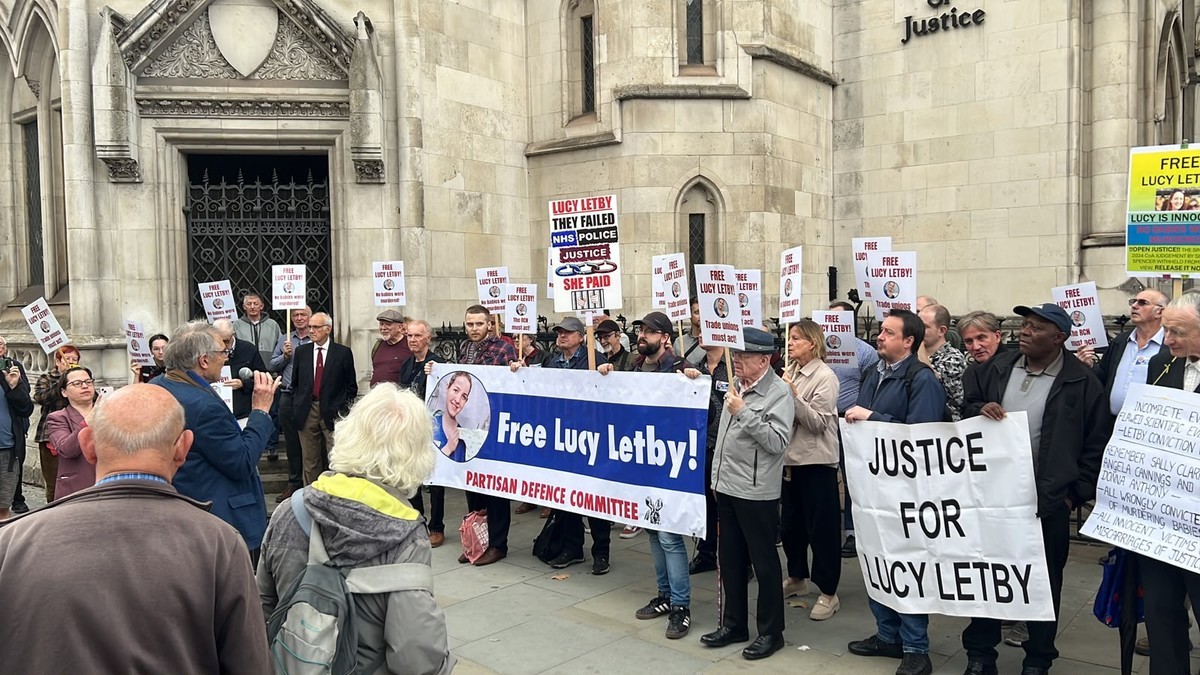 Supporters of convicted murderer Lucy Letby hold banners outside the Royal Courts of Justice in London. Photo: BBC/Trevor Lloyd