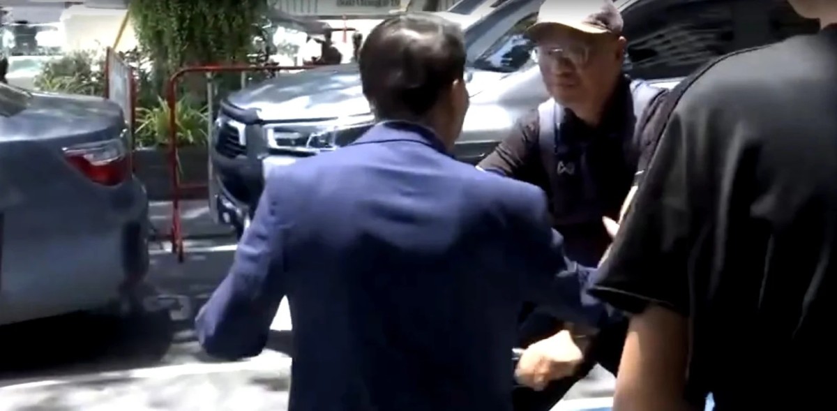 Somchai Shoved Off Bicycle Outside Bangkok Police Station