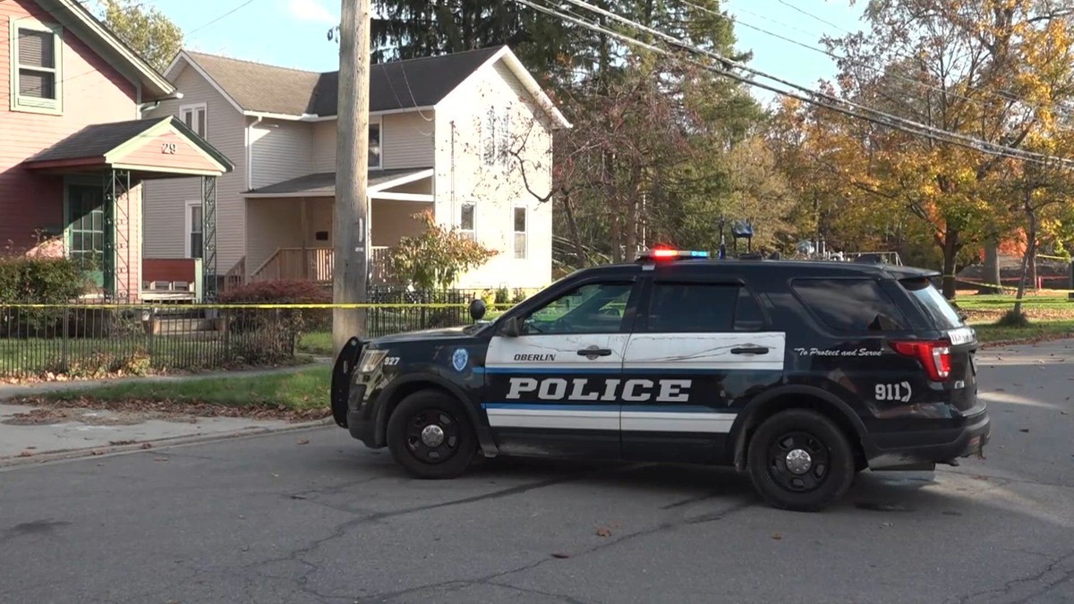 An Oberlin Police vehicle behind yellow police tape on a residential street near the South Pleasant Street home. Photo: 3News/WKYC