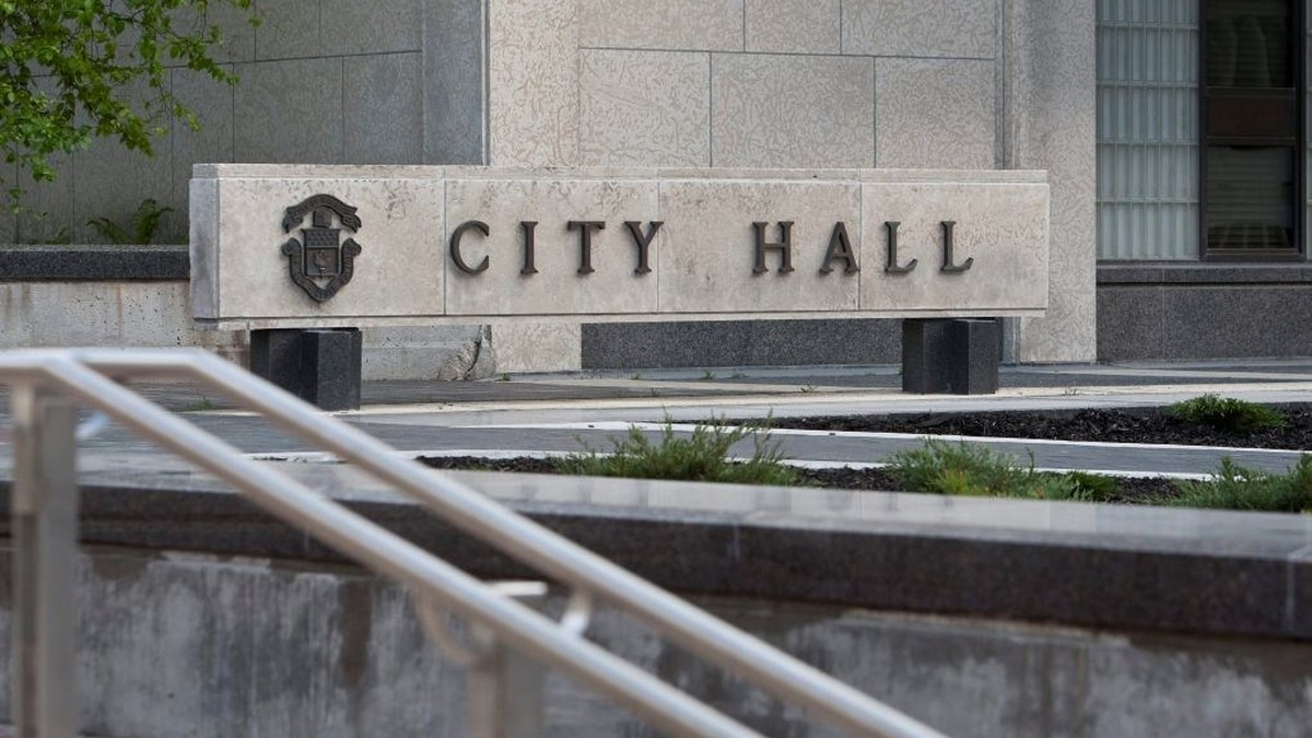 The stone CITY HALL sign at Toronto City Hall. Photo: Global News