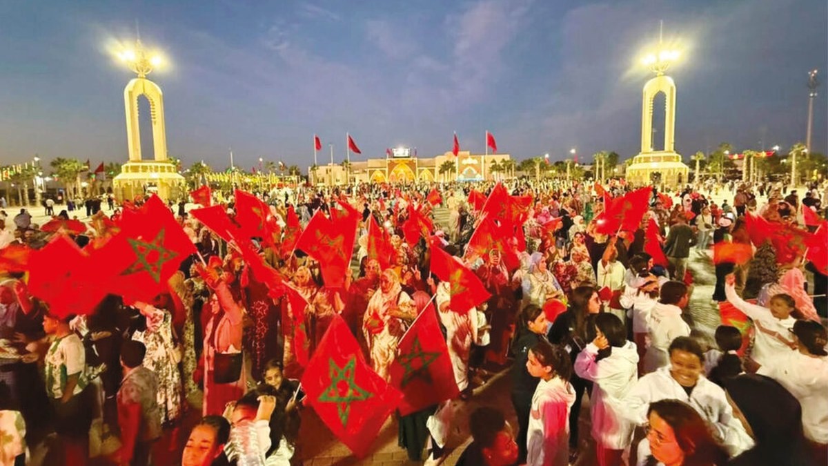 Moroccans hold national flags during celebrations of Unity Day. Photo: APA