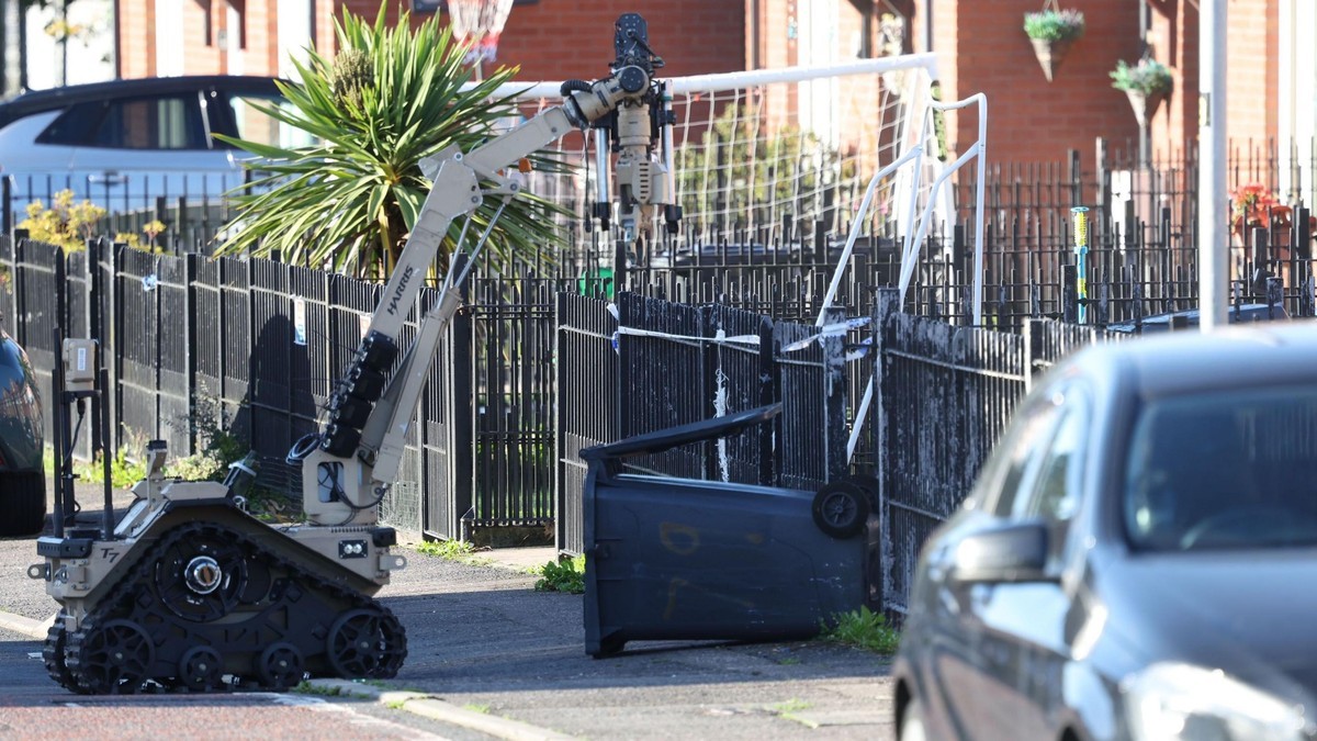 An Army bomb disposal robot works beside an overturned wheelie bin on a residential street in Northern Ireland. Photo: Pacemaker