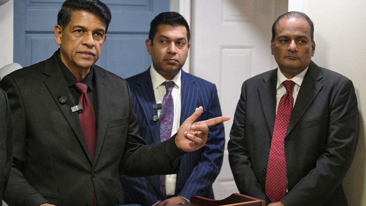 Attorney Prakash Ramadhar points to acting Chief Magistrate Brian Dabideen during a news conference at his San Fernando chambers in June 2026, with attorney Michael Rooplal at centre. Photo: Dexter Philip/Trinidad Express