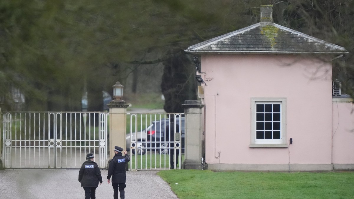 Police at the gates of Royal Lodge in Windsor Great Park, one of the two properties searched by Thames Valley Police. Photo: Jonathan Brady/PA
