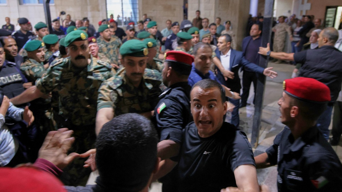 Soldiers and security officers hold back residents outside Prince Ali Military Hospital in Karak, Jordan, during King Abdullah II's visit to the wounded on 23 October 2026. Photo: Associated Press