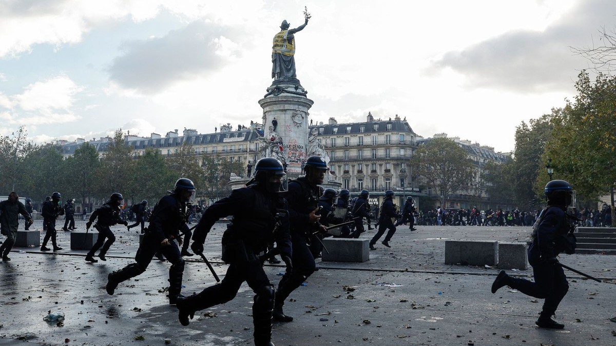 Riot police move through a square in Marseille during clashes on the sidelines of Saturday's demonstration. Photo: Thibaud Moritz/AFP via Getty Images via CNN