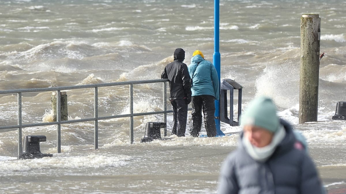 Waves breaking over the ferry terminal at Dagebuell in northern Germany on Sunday as the storm system that Britain called Boelo moved across the North Sea. Photo: Bodo Marks/dpa via AP, carried by Euronews