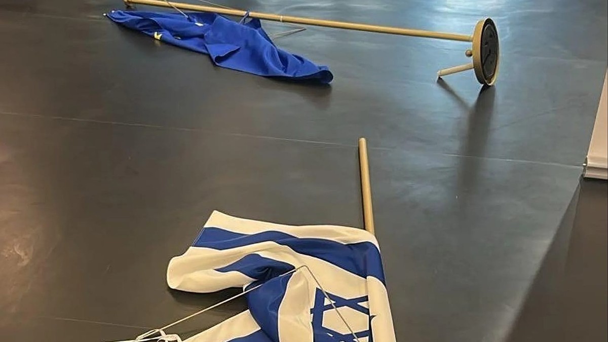 Israeli and European Union flags lie on the floor of the European Parliament in Strasbourg after an MEP removed the Israeli flag from its stand in October 2026. Photo: Euronews