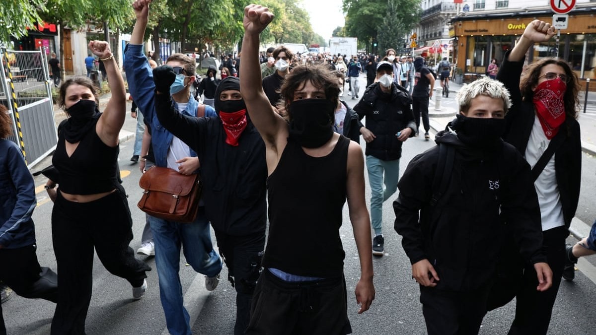 Masked demonstrators march through Paris during a national day of action over high-school conditions on 6 October 2026. Photo: Tom Nicholson/Reuters via The Guardian