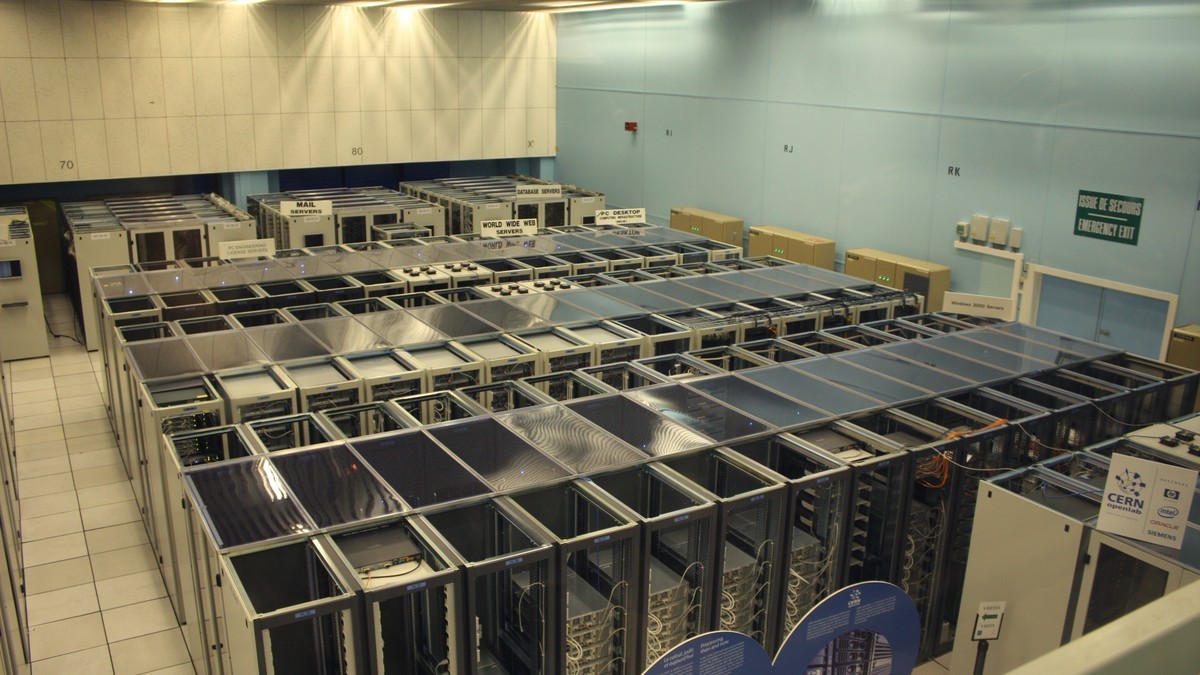 Rows of server racks fill a data centre hall — the kind of virtualised infrastructure whose failure took about 500 servers offline at Osaka Metropolitan University. Photo: CERN via Wikimedia Commons (CC BY-SA 3.0)