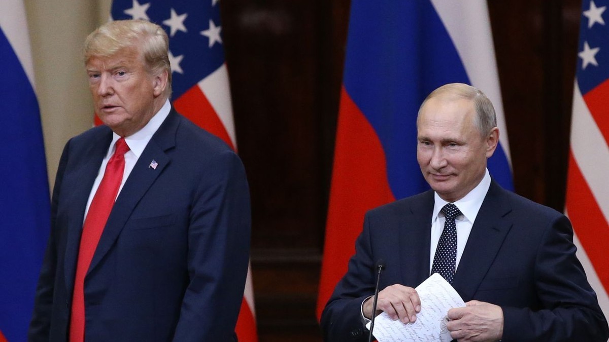 Donald Trump and Vladimir Putin stand at a podium with US and Russian flags behind them. File photograph. Photo: Getty Images via RBC-Ukraine