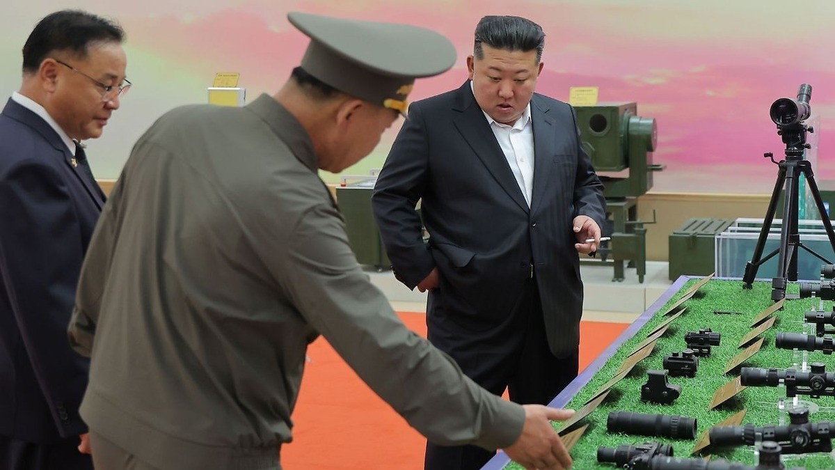 Kim Jong Un inspecting optical equipment at a defense exhibition in North Korea. Photo: AP via Times Now