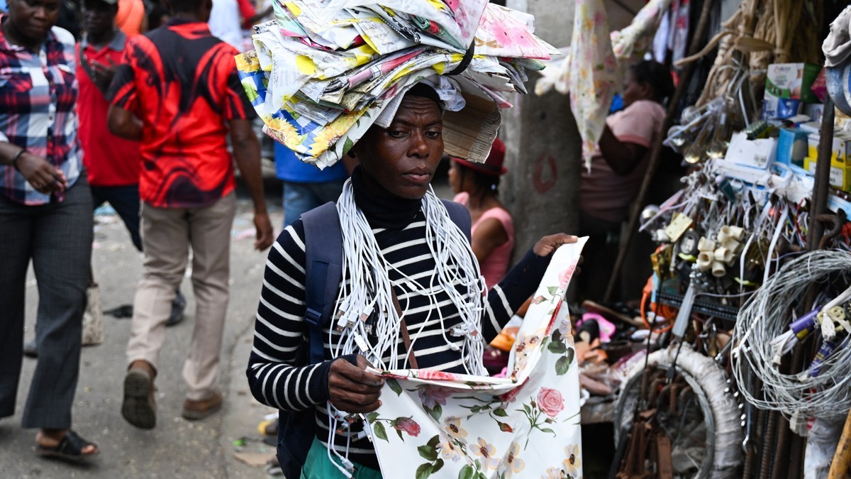 Women walk past a market stall in Port-au-Prince, Haiti, on 28 October 2026. Photo: Clarens Siffroy/AFP