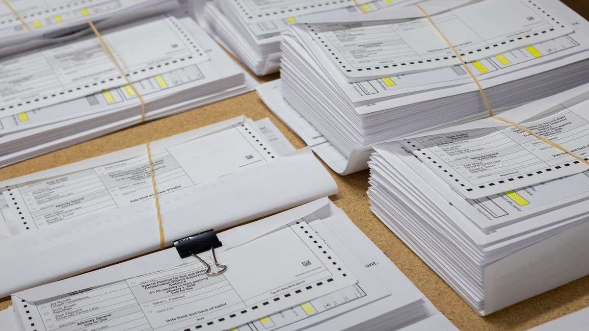Stacks of mail-in ballot packets being prepared for mailing at the Stearns County Service Center in Waite Park, Minnesota, in September 2026. Photo: Kimm Anderson for MPR News