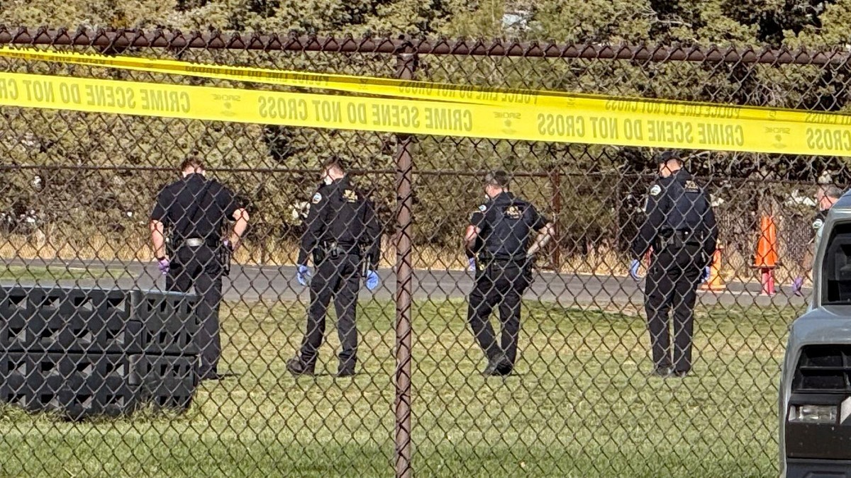 Police officers work behind a secured perimeter at Silver Rail Elementary School in Bend, Oregon, on Oct. 15, 2026. Photo: Eleanor Moseman / Oregon Public Broadcasting