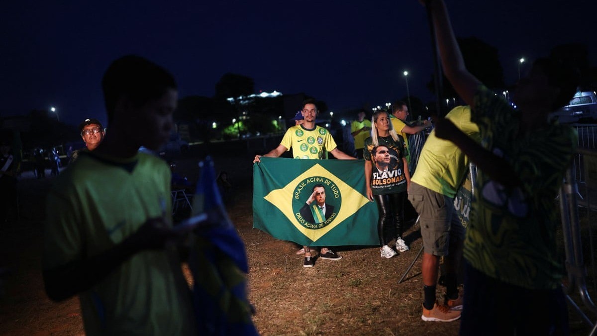 Supporters of Senator Flavio Bolsonaro wait for the first results of Brazil's presidential runoff on the street in Brasilia on 25 October 2026. Photo: Agustin Marcarian/Reuters via The Guardian