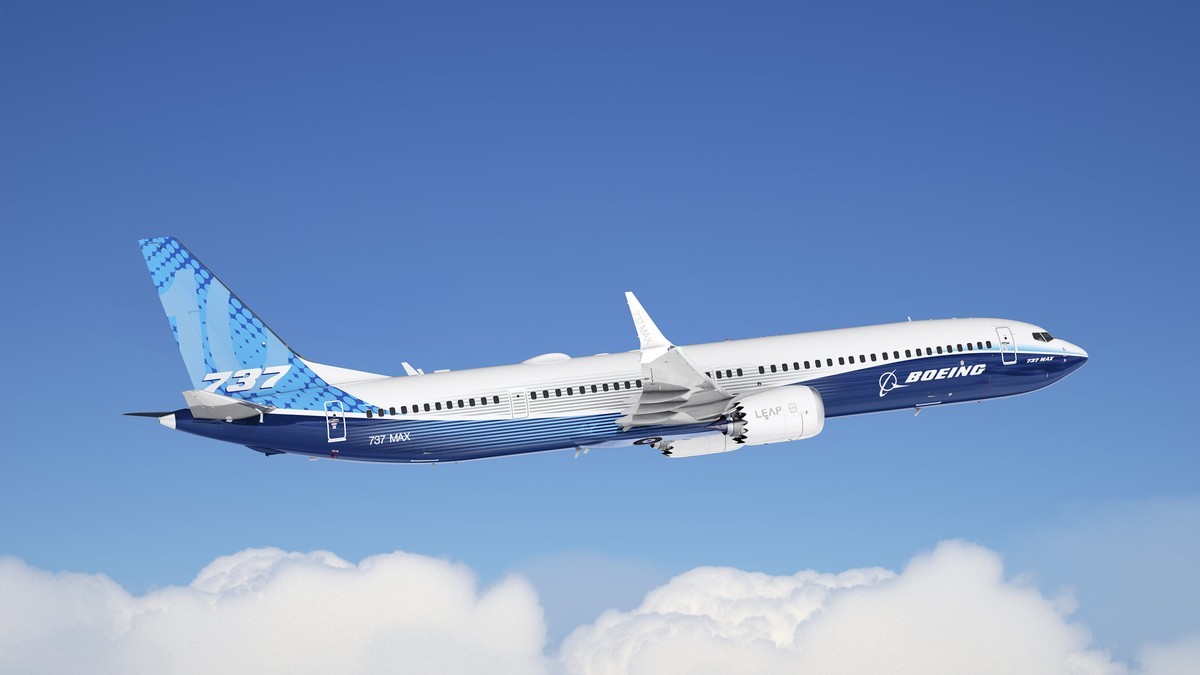 A Boeing 737 MAX family aircraft in Boeing house livery in flight over cloud. Photo: Boeing