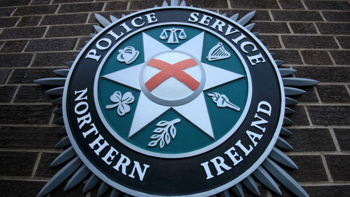 The Police Service of Northern Ireland emblem mounted on a brick wall. Photo: BBC
